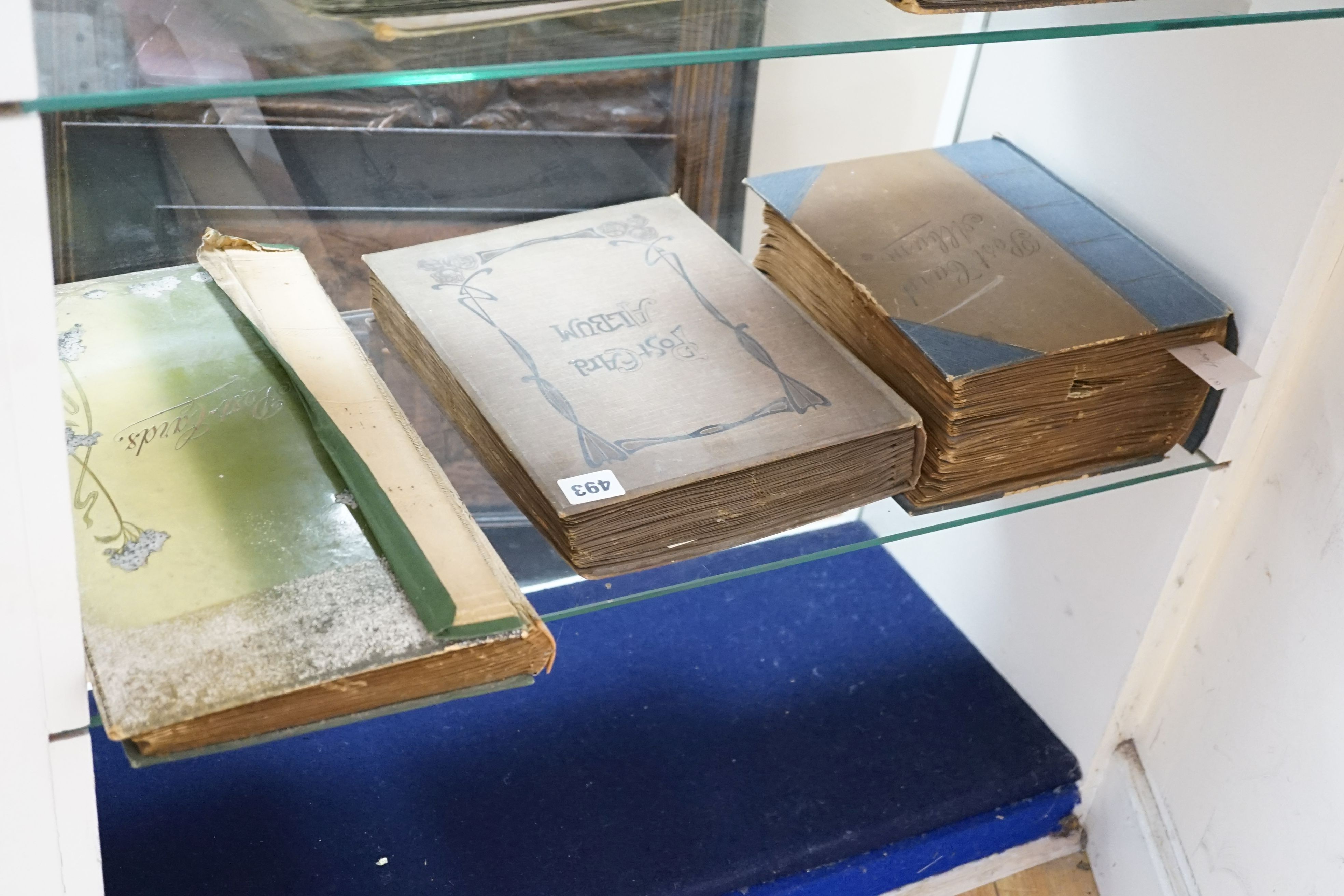 Three postcard albums and contents